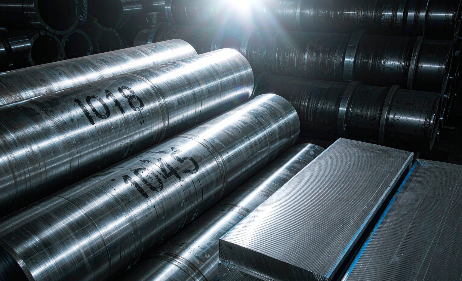 AISI 1030 and 1045 carbon steel round bars side by side