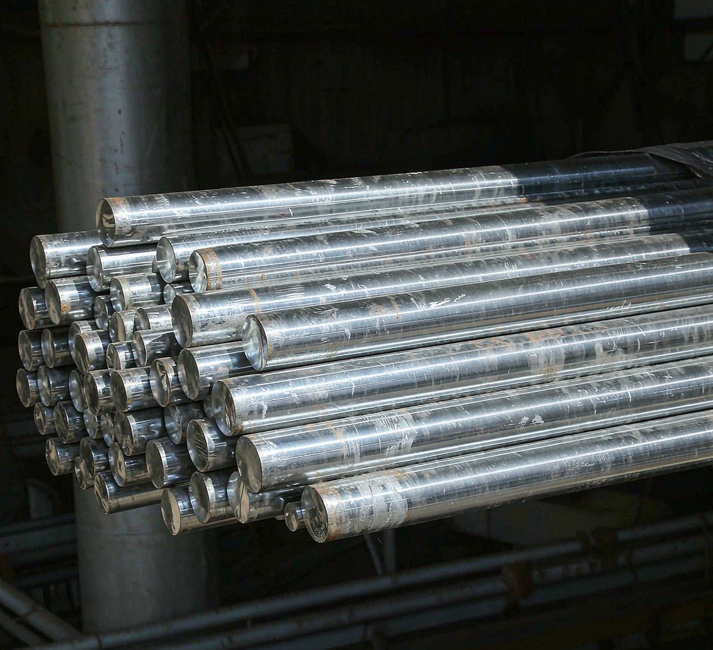 Bundles of bright carbon steel bars in warehouse