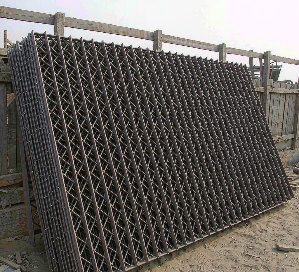 Carbon steel welded bar grating panels stacked in a yard