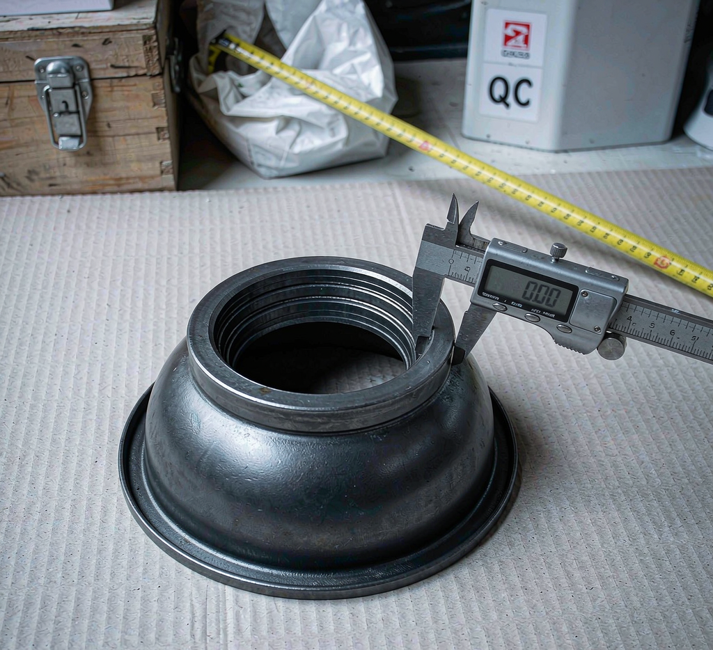 Carbon steel pipe cap dimension inspection with caliper