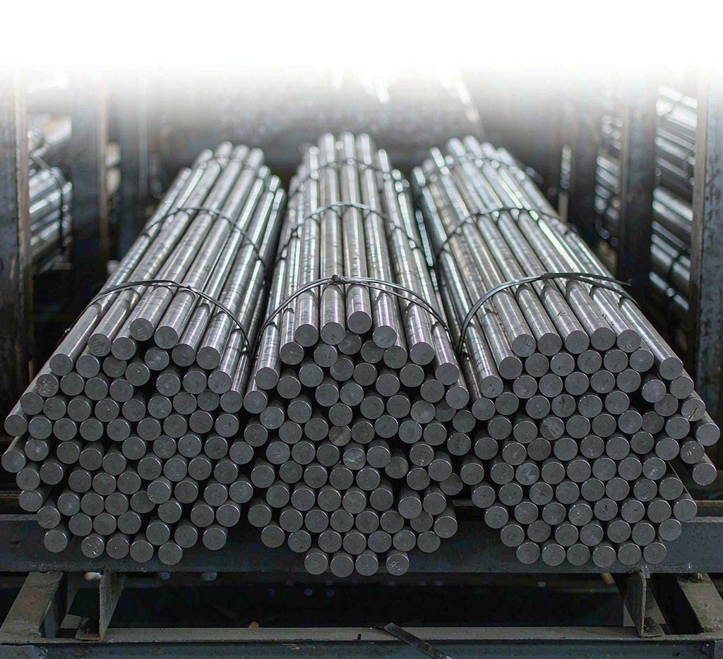 Bundled carbon steel round bars in a warehouse