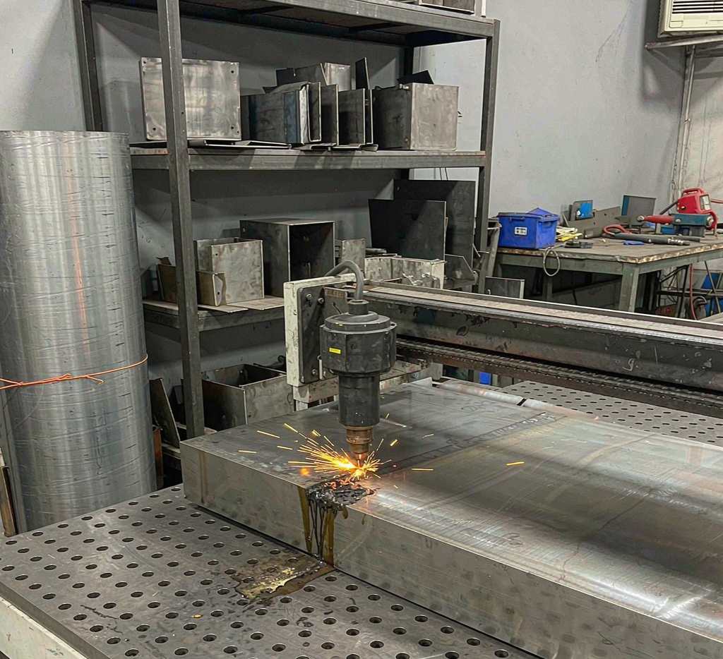 Laser cutting carbon steel sheet in a fabrication workshop