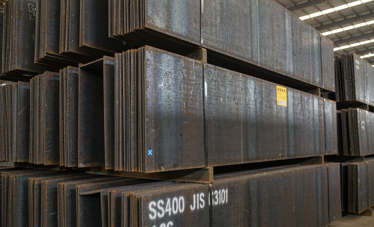 Carbon steel T-bar sections stacked in a steel warehouse