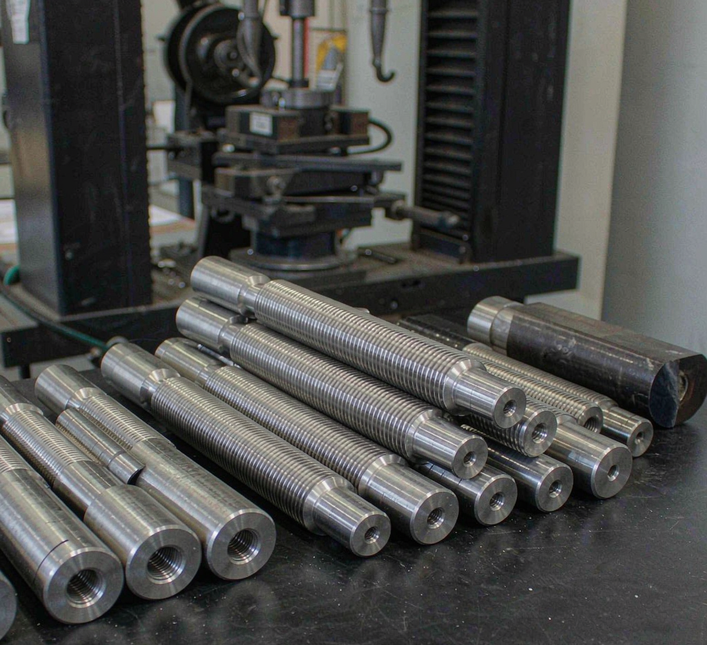 Tensile test specimens machined from structural carbon steel plates