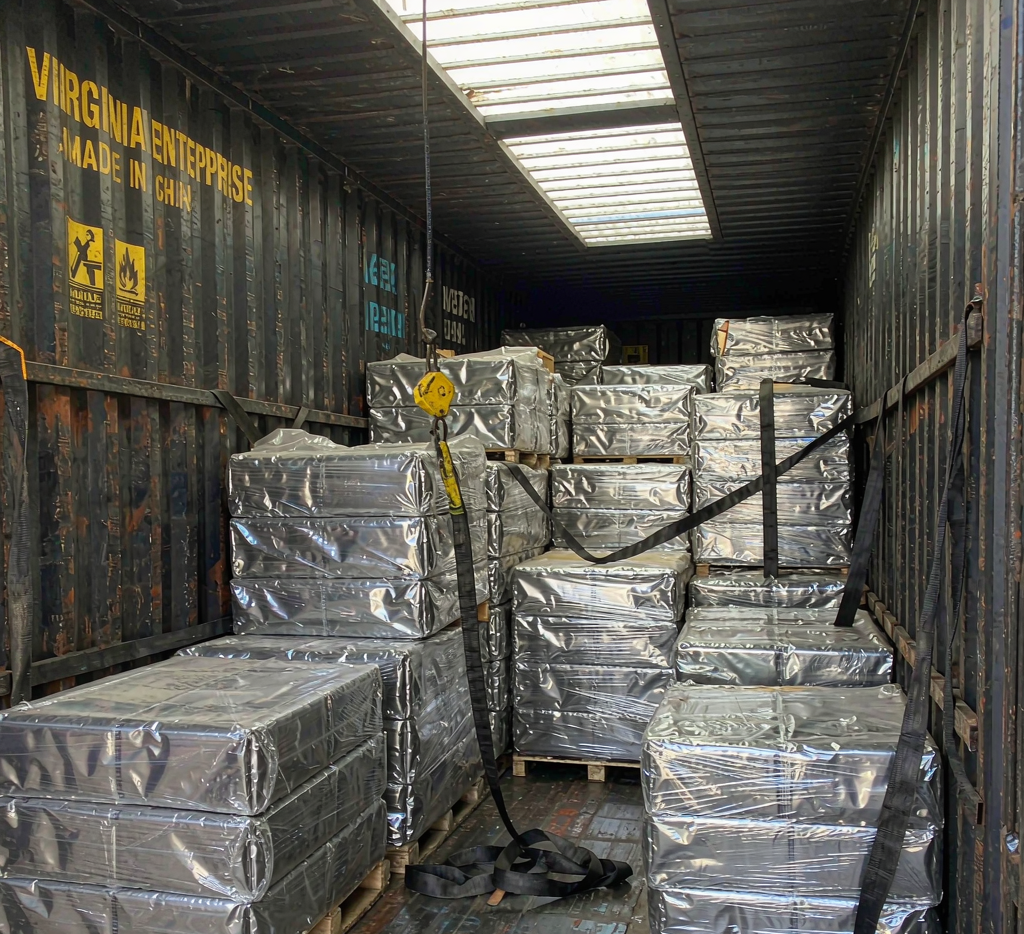 Steel bundles loaded and secured inside a shipping container