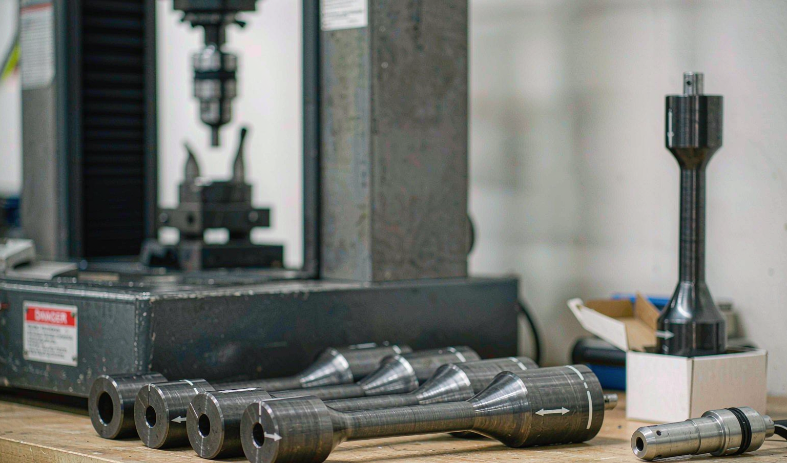 Tensile test specimens prepared from 4140 and 1045 steel