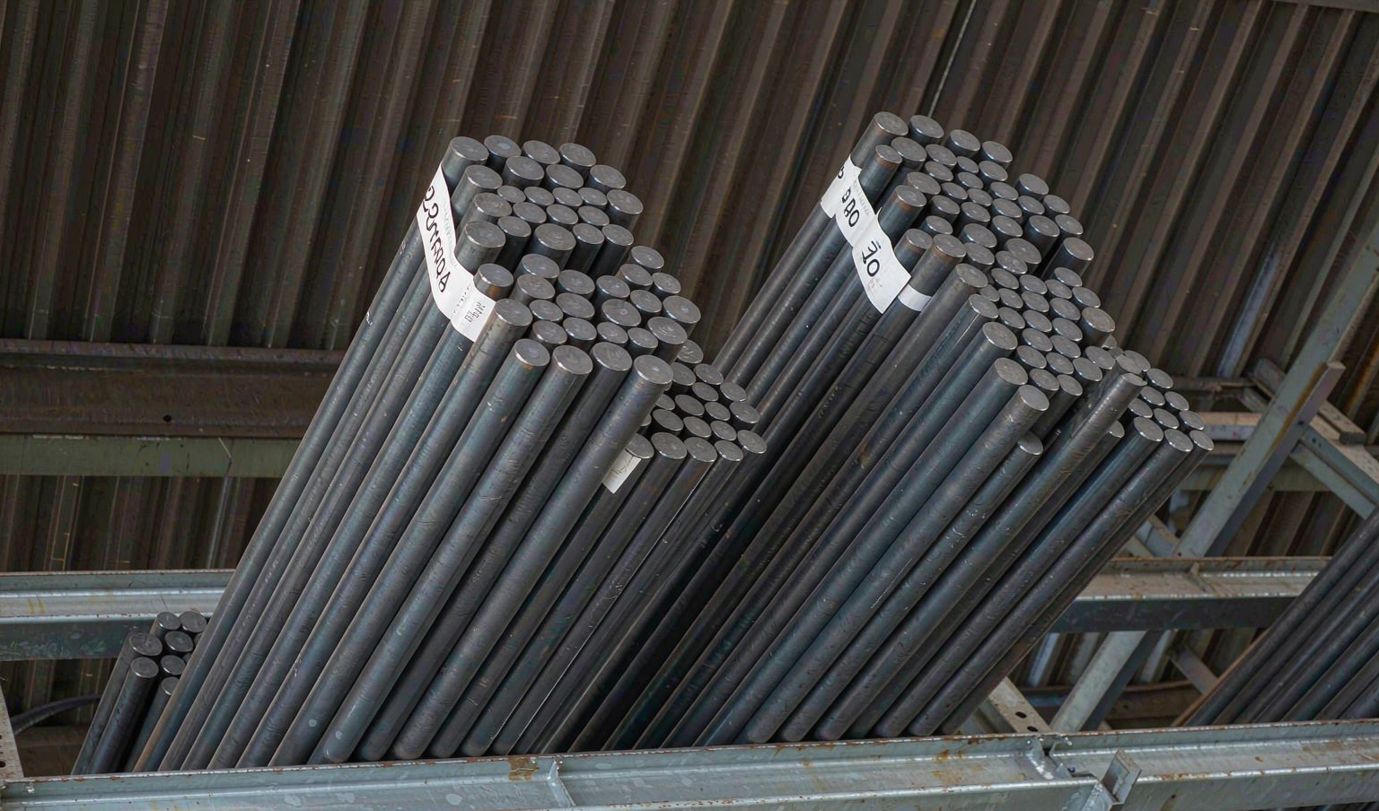 42CrMo and 4140 alloy steel round bars stacked in warehouse