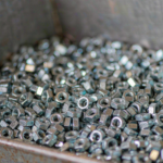 Carbon Steel Hex Nut — Factory Direct Supplier | Huaxia-Steel Bulk_hex_nuts_piled_in_a_steel_2026-10-26T01-41-59_crop.png