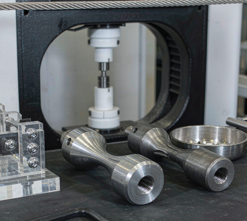 Tensile test specimens machined from 1018 carbon steel bar